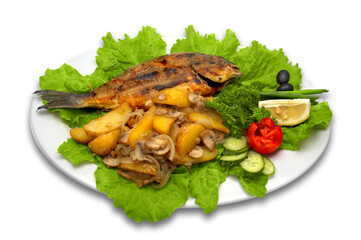 whole griled dorada fish, with baked potato, mushrooms and fresh vegetables, lays on lettuce leaves with lemon slice.