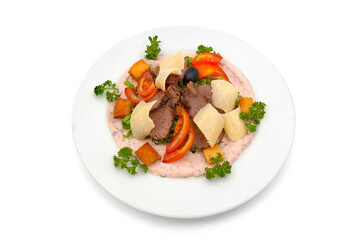 Veal salad with sliced fresh tomato, parmesan chips and cracker pieces, dressed with rose sauce and parsley
