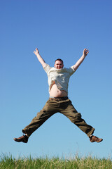 Fototapeta na wymiar happy man jumping on sky background