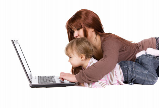 mother and daughter playing on laptop