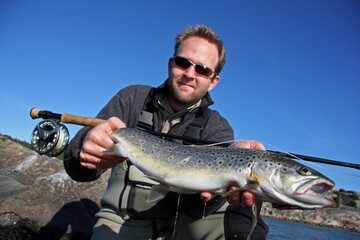 A man displaying a nice sea trout