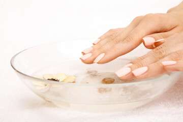 Close up of the hands taking a salt bath, isolated