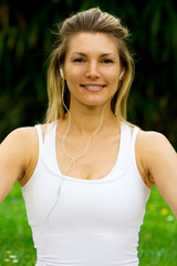 Blonde girl in nature green park exercising yoga, fitness program