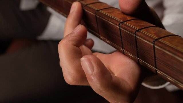playing turkish saz