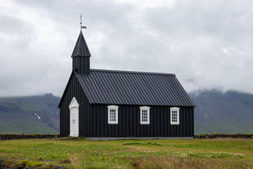 Fototapeta na wymiar Iceland Black Church in a green meadow
