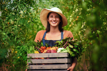 Farmer, agriculture and portrait of woman with crate on farm after harvest of summer vegetables. Farming, female person and smile with box of green product, food or agro in nature for sustainability - obrazy, fototapety, plakaty