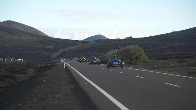 Trike motorcycles on road through vineyards, La Geria, Uga, Las Palmas, Lanzarote
