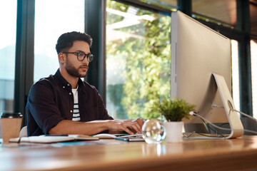 Computer, serious and a business man typing and working at desk while online for research or...