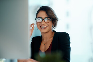 Business woman, happy and computer in glasses reflection for reading, online review and editor analysis or news. Smile of biracial person or professional worker with website or results on desktop pc - Powered by Adobe