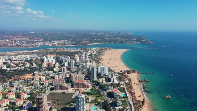 Tourist Portuguese city of Portimao aerial view on a sunny day. South Portugal Algarve. view of the beaches and the river Arade.