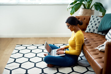 Floor, computer and woman in work from home, studying and e learning and college education website. Relax, living room carpet and person or student typing on laptop, internet or elearning application