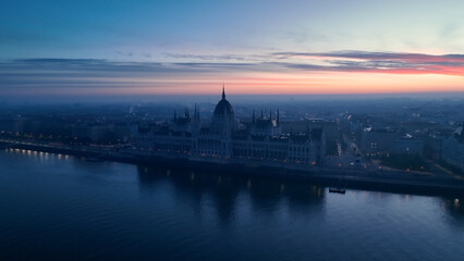 Fototapeta na wymiar Aerial view of Hungarian Parliament Building at sunrise with the Danube river, in Budapest, Hungary