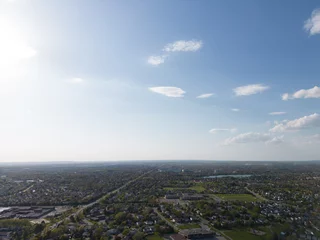 Foto op Canvas Drone view, sun-drenched Brampton real estate, lush green yards, picturesque houses off Bramalea-Mayfield. Summer in Ontario at its best © contentzilla