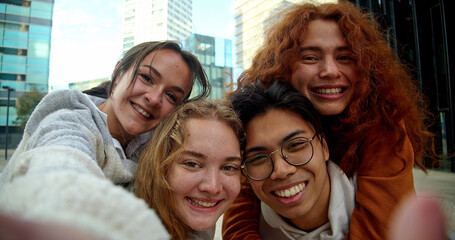 Selfie portrait of a group of young people having a good time. Friendship, Happy people looking at the camera.