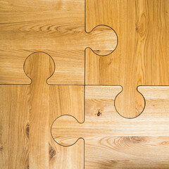 closeup shot of four wooden pieces of puzzle, wooden crafts, woodworking. High quality photo