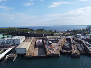 barge under repair in falmouth harbour aerial drone