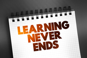 Learning Never Ends text on notepad, concept background