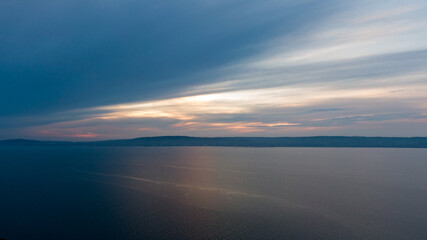 Fototapeta na wymiar Aerial view on coast of sea at sunset in Helens Bay, Northern Ireland, UK. 