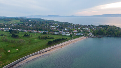 Aerial view on coast of sea at sunset in Helens Bay, Northern Ireland, UK. 