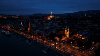Establishing Aerial View Shot of Matthias church and Fishermans Bastion at night. Budapest, Hungary