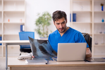 Young male doctor radiologist working in the clinic