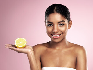Lemon fruit, skincare and portrait of happy woman in studio mockup, pink background and vitamin c benefits. Face of african model, citrus and natural beauty for cosmetics, vegan dermatology and shine