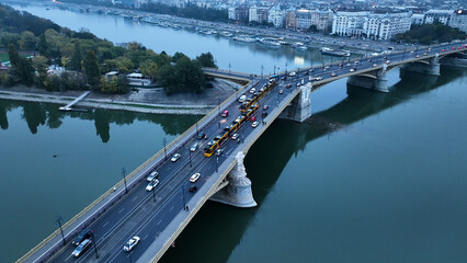 Aerial view of Budapest Margaret Bridge or Margit hid over River Danube, embankment. Yellow tram...