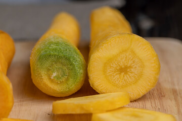 Sliced bright yellow carrots on the table