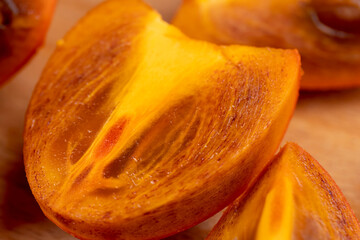 slices of sliced persimmon on a cutting board