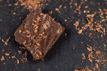 a crumbled piece of bitter chocolate into small pieces
