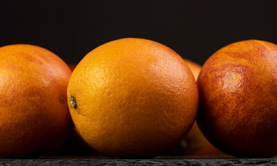 round whole red ripe group of oranges close-up
