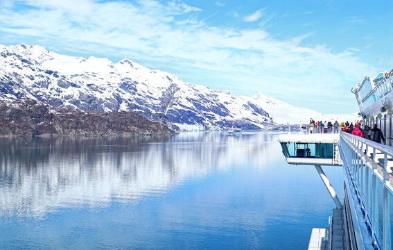 Cruise ships at Glacier Bay National Park, Alaska, USA.  Passengers on Deck Viewing Approach to Glacier. 