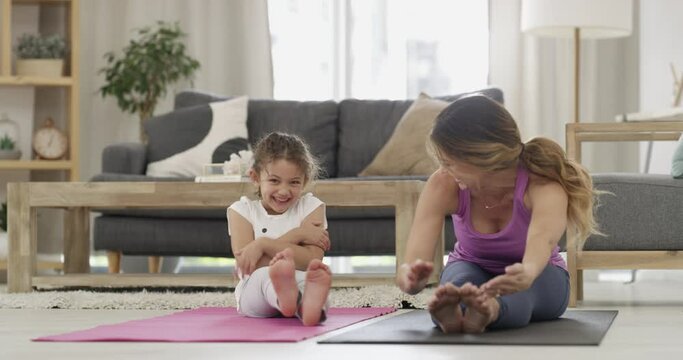 Yoga, stretching and a mother with a tickling child, exercise and mindfulness in the morning. Happy, family and a mom and little girl doing stretches or pilates for health and relax together at home