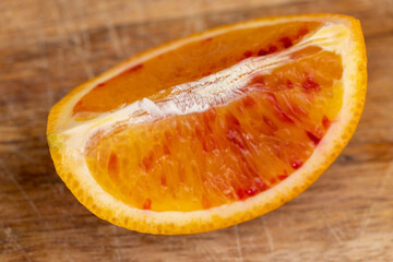 the red-orange flesh of an orange sliced in close-up