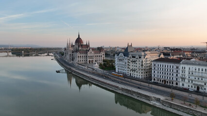 Obraz na płótnie Canvas Amazing Skyline Establishing Bird Eye Aerial View Shot of Budapest city. Hungarian Parliament Building with the Danube river at sunrise. Hungary