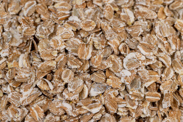 a bunch of fresh dry oatmeal flakes for making porridge