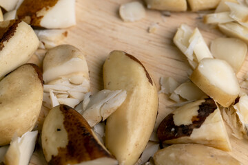 Fresh Brazil nuts peeled from the shell on the table