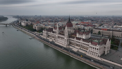 Fototapeta na wymiar Establishing Aerial View Shot of Budapest, Hungarian Parliament Building during a cloudy day, Hungary