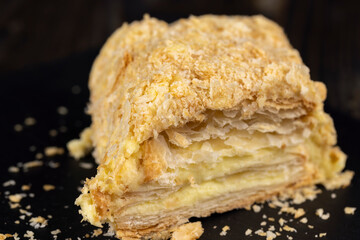 delicious piece of cake with puff pastry and sweet cream