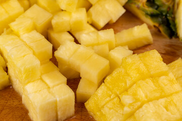sliced ripe yellow pineapple, a large number of pieces