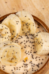 fresh banana-flavored yogurt with banana slices sprinkled with chia