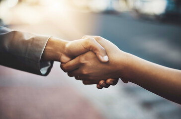 Business people, handshake and meeting in city for b2b, partnership or introduction and greeting outdoors. Hand of employees shaking hands for team collaboration, agreement or deal for hiring in town