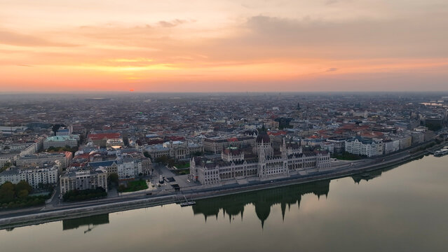 Amazing Skyline Establishing Bird Eye Aerial View Shot of Budapest city. Hungarian Parliament Building with the Danube river at sunrise. Hungary © Vgallery