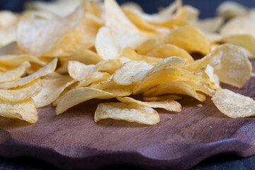 thin potato chips with spices, close up
