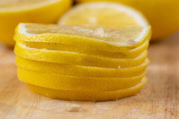 Fototapeta na wymiar Yellow ripe lemon cut into slices