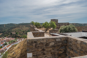 Wall of the Castle of Mértola on a hill with houses, Alentejo PORTUGAL