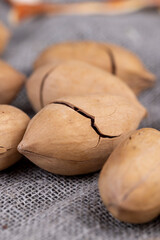 Unpeeled crunchy pecans close up
