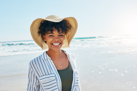 Woman, face portrait and summer at the beach for a vacation, travel or holiday with a smile. African female person at sea with happiness, freedom and positive mindset to relax outdoor