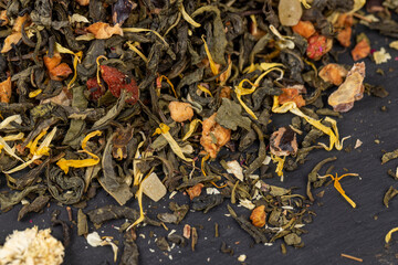 fresh green tea with pieces of fruit and berries
