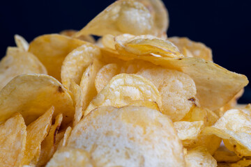 thin potato chips with spices, close up